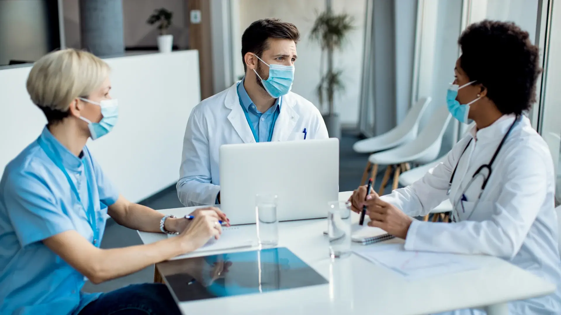 Doctors collaborating on medical documentation used as digital evidence in mass tort litigation.