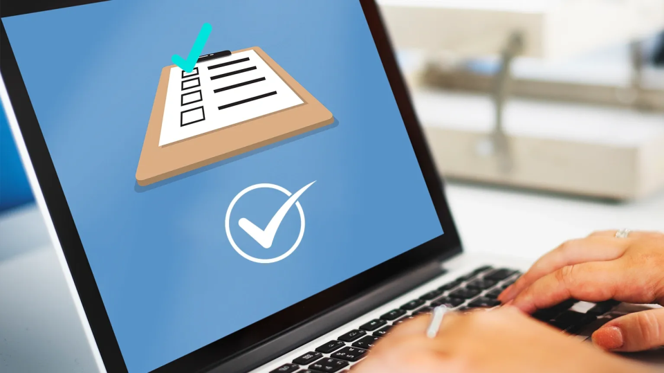 Laptop screen showing a check mark