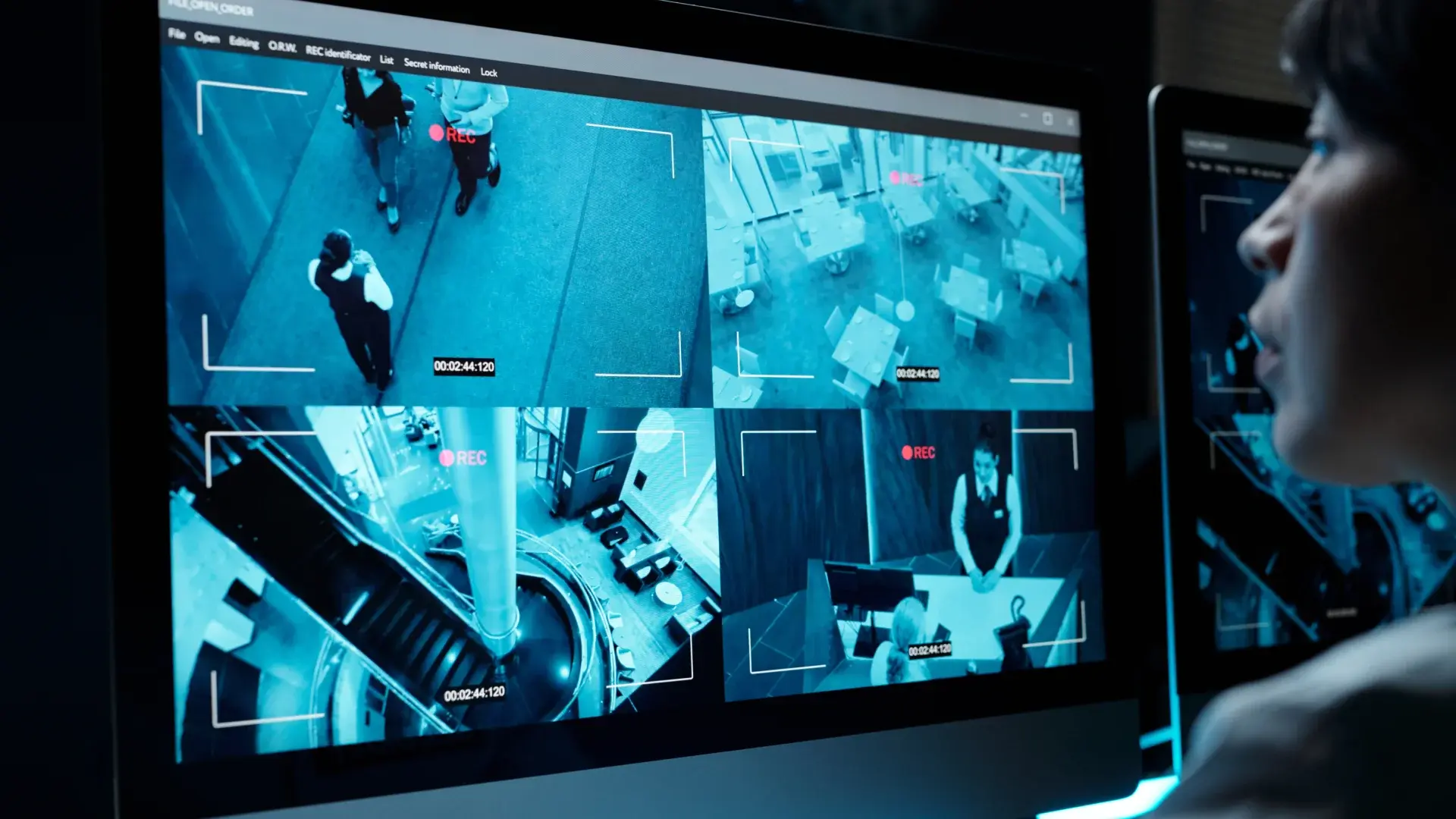 A person looking at electronic evidences on multiple screens