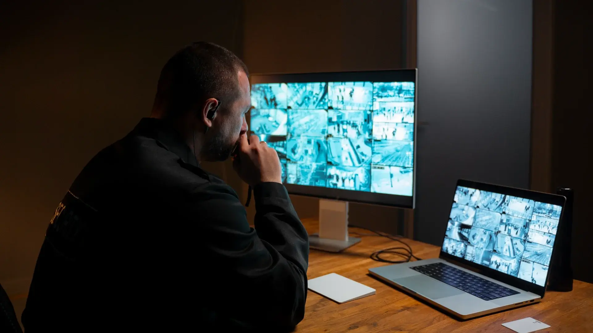 An Officer looking at the Screens for Digital Evidences